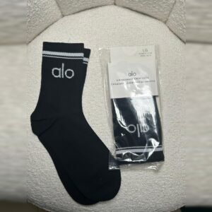 Unisex half-crew socks in black with white stripe